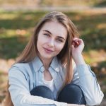 portrait blonde woman looking photographer