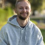 smiley man relaxing outdoors